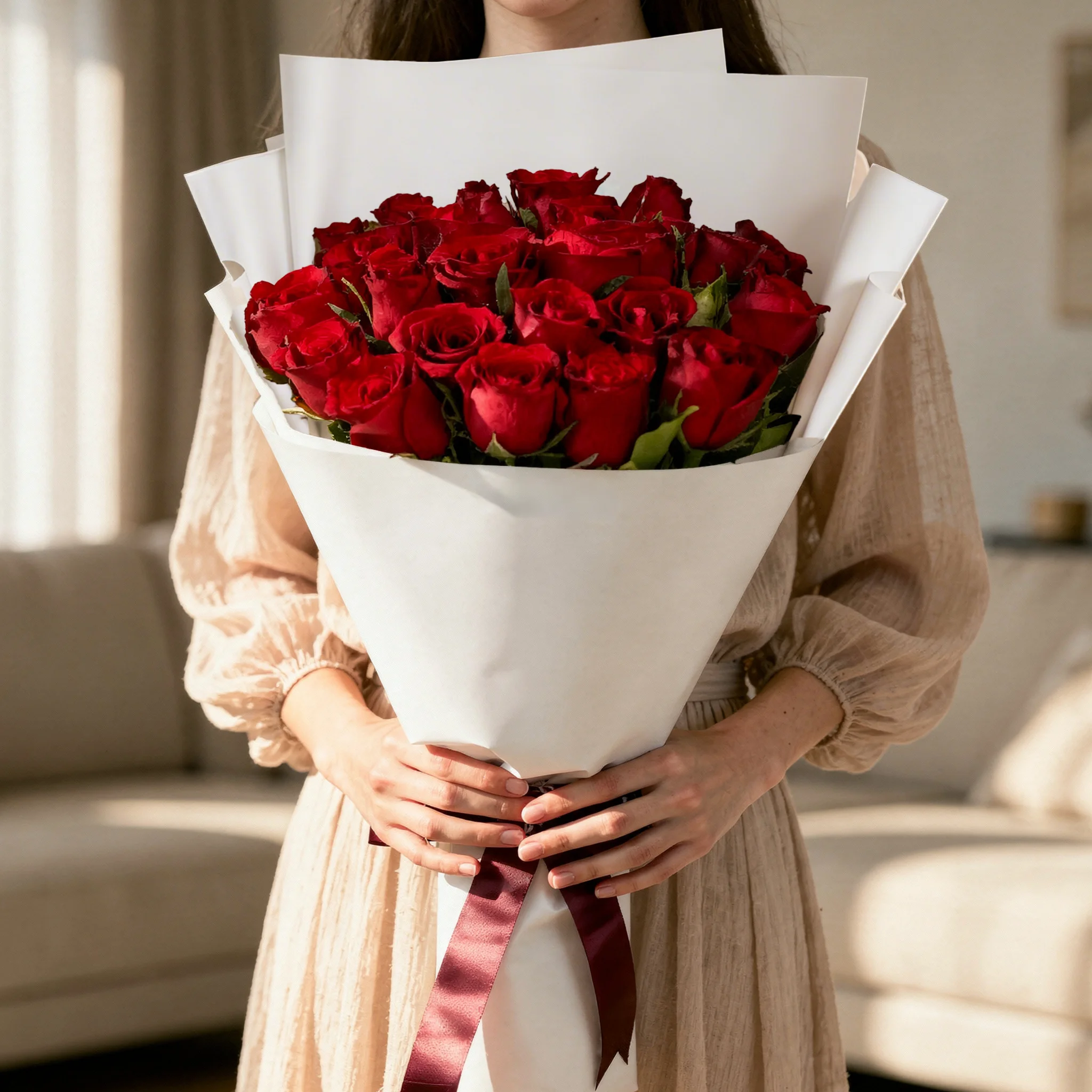 A bouquet of red roses with babys breath