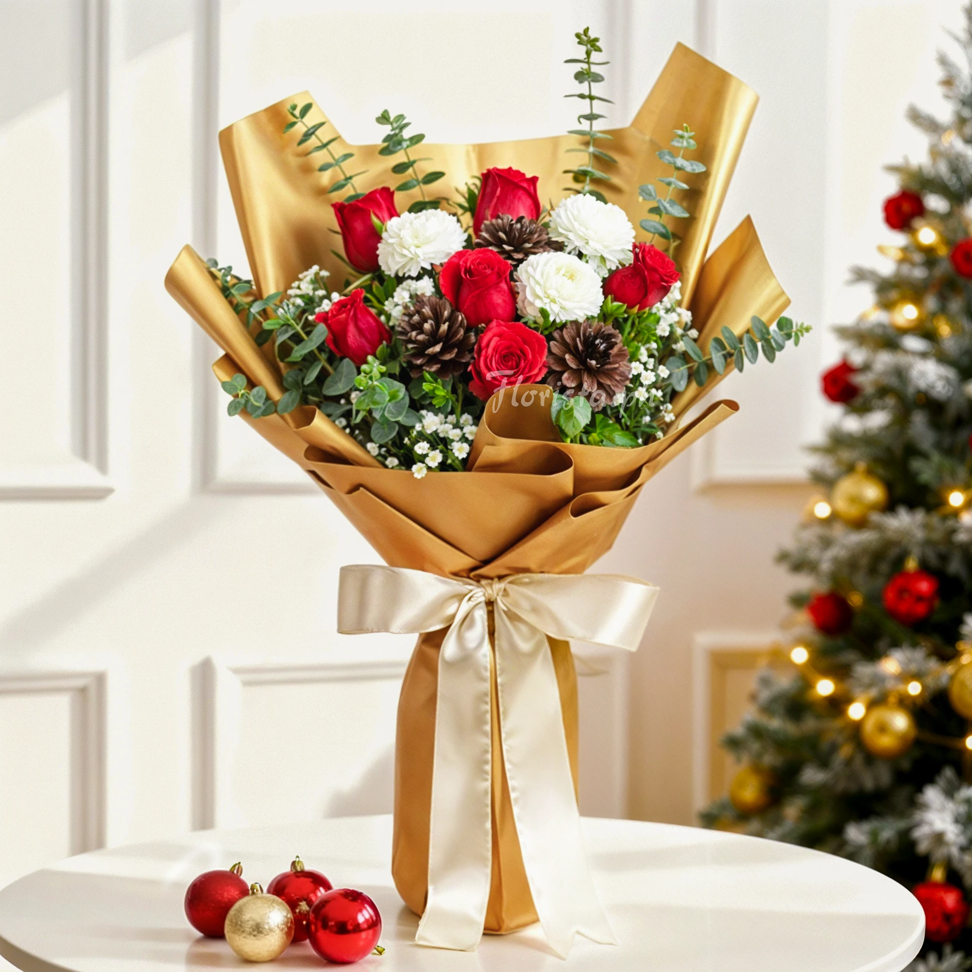 Bouquet of 6 red roses, 3 pinecones, 4 white carnations with baby's breath and green fillers in brown wrapping tied with ribbons.