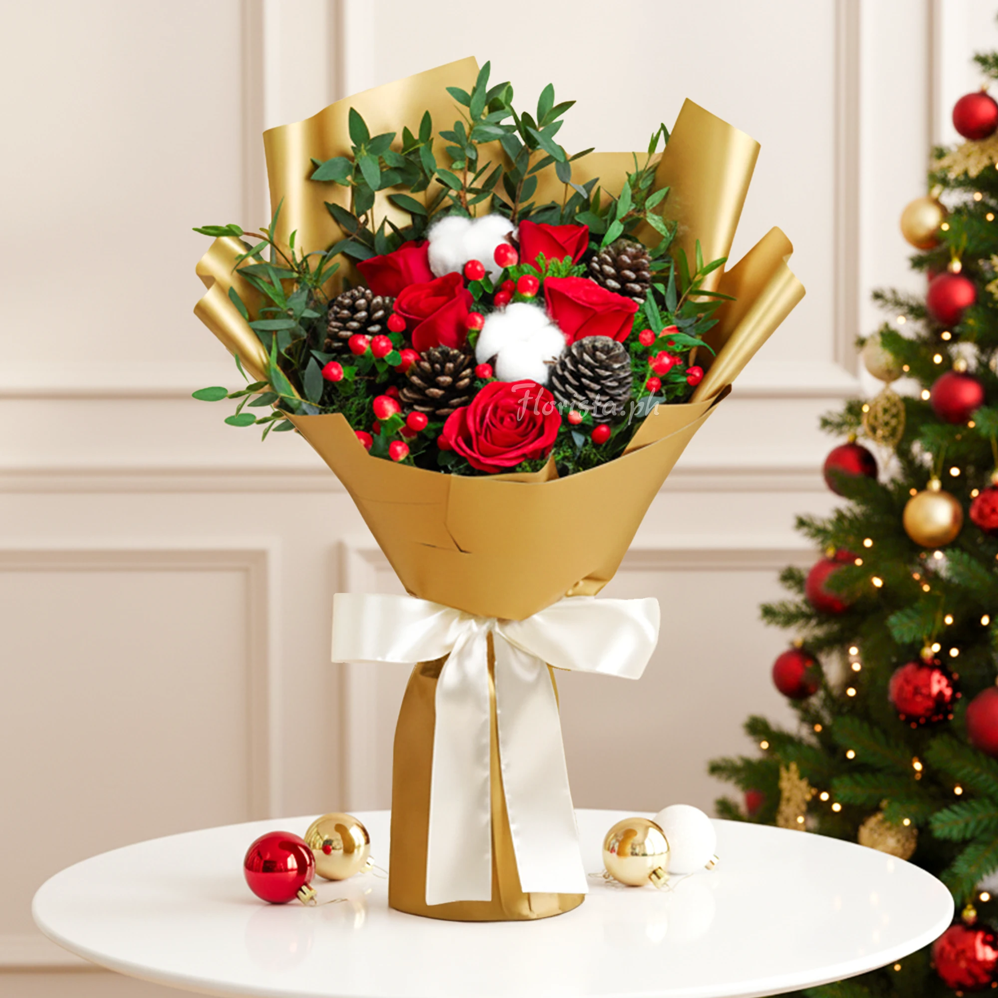 Bouquet of 5 red roses, 4 pinecones, 2 gossypium (Cotton Stems) and red berries with green fillers in brown wrapping tied with white ribbons.