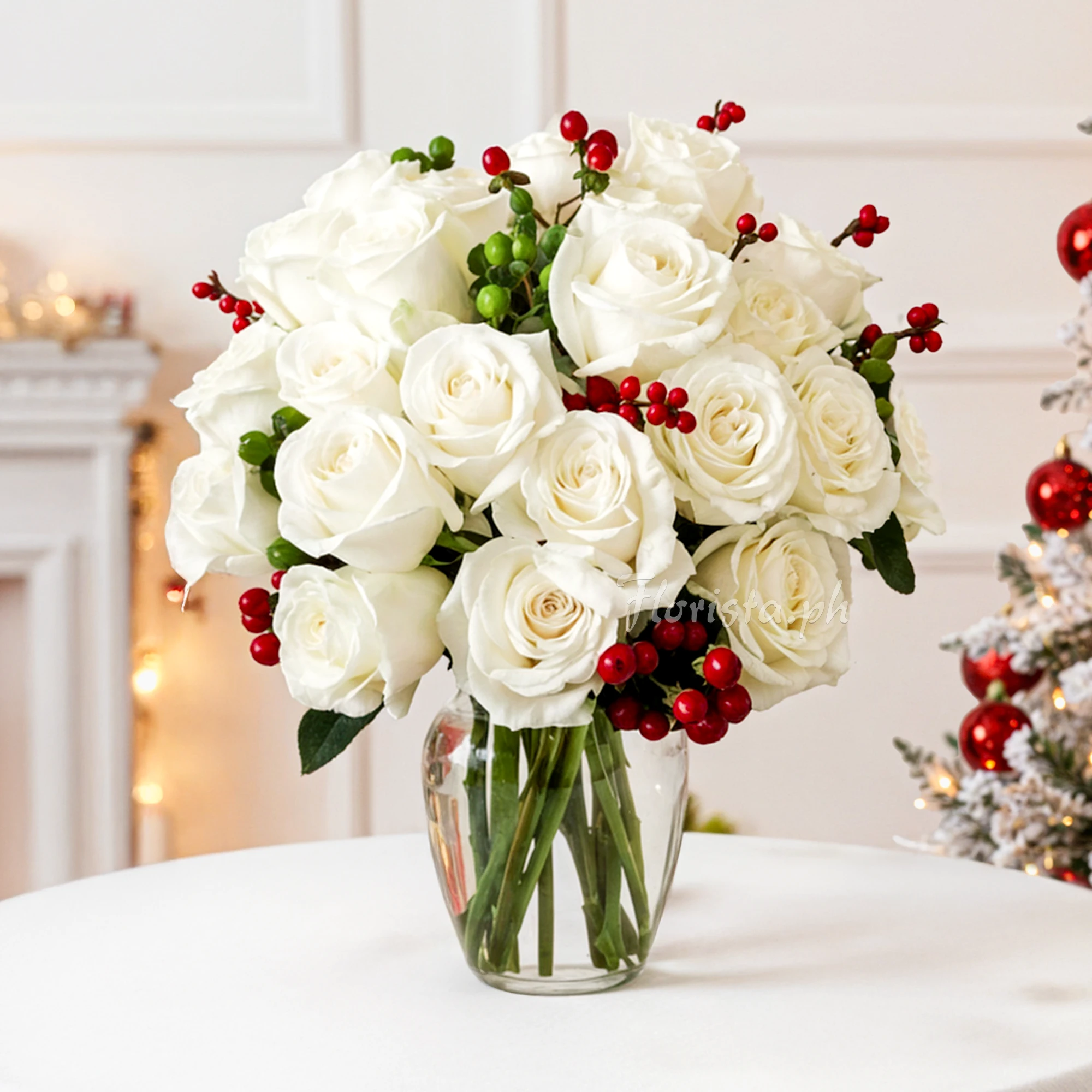 12 white roses with seasonal berries in a vase