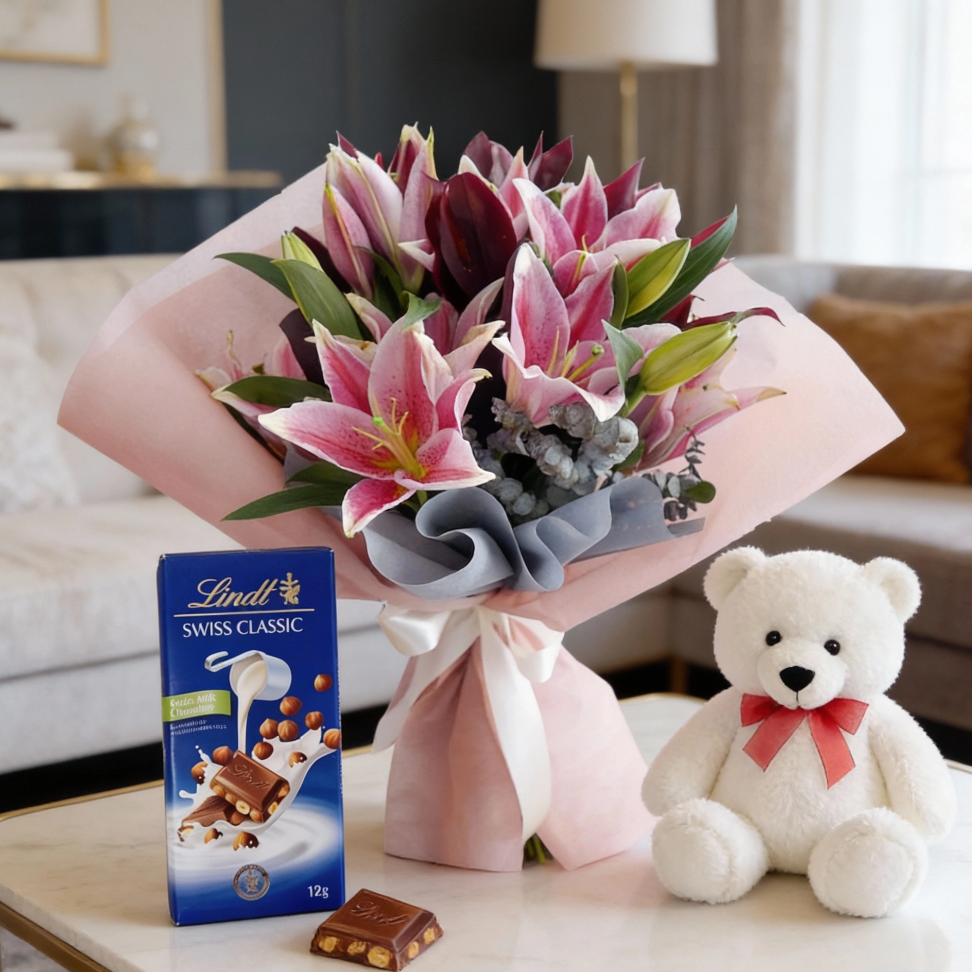Pink lilies bouquet with teddy and chocolate